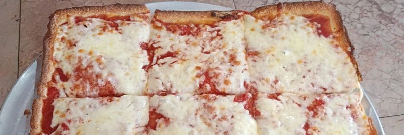 Square Sicilian cheese pizza cut into squares